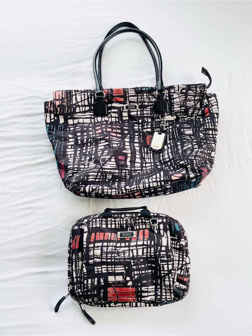 Tumi carry-on laptop bag + hanging cosmetic case set. 2 items total included